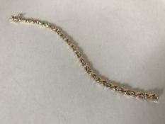 An 18ct gold bracelet set with thirty-six diamonds approximately 1ct, 14.95g.