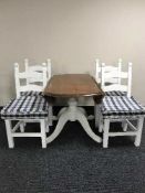 A pine drop leaf kitchen table and four chairs