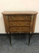 A continental inlaid mahogany three drawer chest