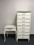 A cream and gilt narrow eight drawer chest and a bedside stand