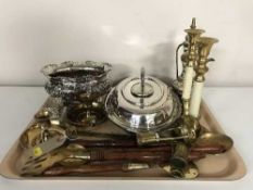 A tray of plated entree dish, bowl, brass candle holders, napkin rings,
