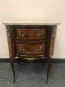 An inlaid walnut marble top chest