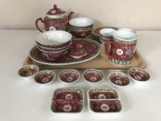 A tray of china teapot, rice bowls, plates,