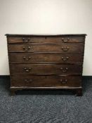 An early Victorian five drawer chest on bracket feet