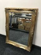 A gilt framed over mantle mirror
