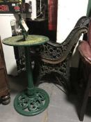Two pairs of cast iron bench ends and sun dial