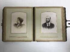 An antique leather bound photo album of monochrome photos