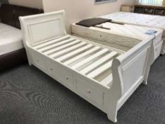 A white 3' sleigh bed fitted three drawers