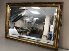 A gilt framed etched mirror depicting gypsy caravan