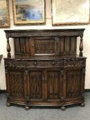 A carved oak buffet sideboard