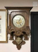 A continental mahogany wall clock