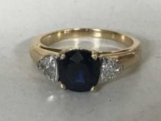 An 18ct gold sapphire and diamond ring,