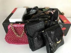 Two boxes of assorted lady's hand bags and shoes