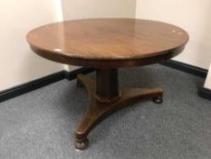 A Victorian mahogany tilt top dining table