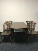 An Ercol drop leaf table and four chairs
