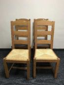Two pairs of oak dining chairs