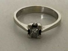An 18ct white gold diamond solitaire ring ,