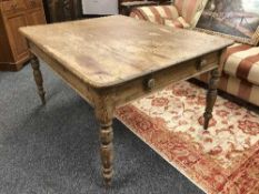 A Victorian pine farmhouse table fitted a drawer