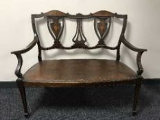 A Victorian inlaid mahogany two seater bench