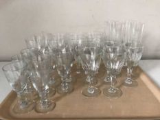 A tray of etched glass drinking glasses
