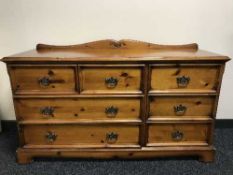 A pine seven drawer chest