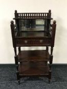 A mahogany mirrored telephone stand