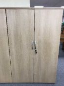 A double door office stationary cupboard,