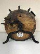 An Edwardian Kent's Knife Cleaner, Kent`s Patent, oak with brass mounts, on cast iron frame,