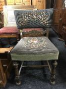 A carved oak occasional chair