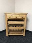 A pine butcher's block trolley