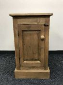 A reclaimed pine single door cabinet