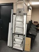 A pair of folding steps and a Flip Chart stand with pad,