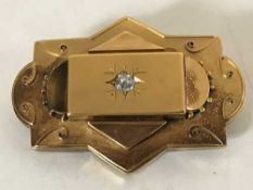 A very large 15ct gold diamond set brooch, 17.3g, central stone approximately 0.3ct.