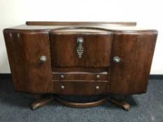 A walnut cocktail sideboard