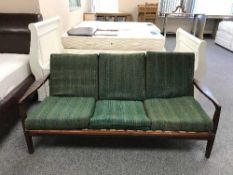 A teak framed settee