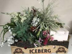 Two boxes of artificial flowers and plants
