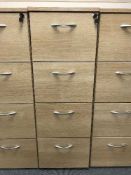 Four drawer wood effect filing cabinet with key