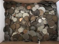 A box containing a collection of mostly English pre-decimal coins