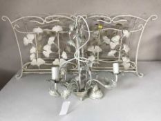 Two white metal mag racks and a three way light fitting