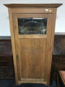An oak Sentry door cabinet