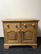 A pine double door cabinet