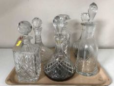 A tray of six assorted lead crystal decanters with stoppers