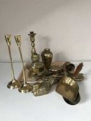 A tray of brass coal scoops, oil lamp,