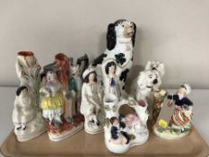 A tray of three Staffordshire vases, two Staffordshire figures,