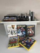 A box and bag of DVDs