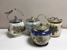 A tray of four china and plated biscuit barrels