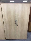 A double door office stationary cupboard,