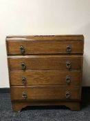 An oak four drawer chest