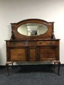 A mahogany mirror backed sideboard