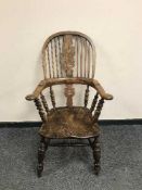 A 19th century elm Windsor armchair